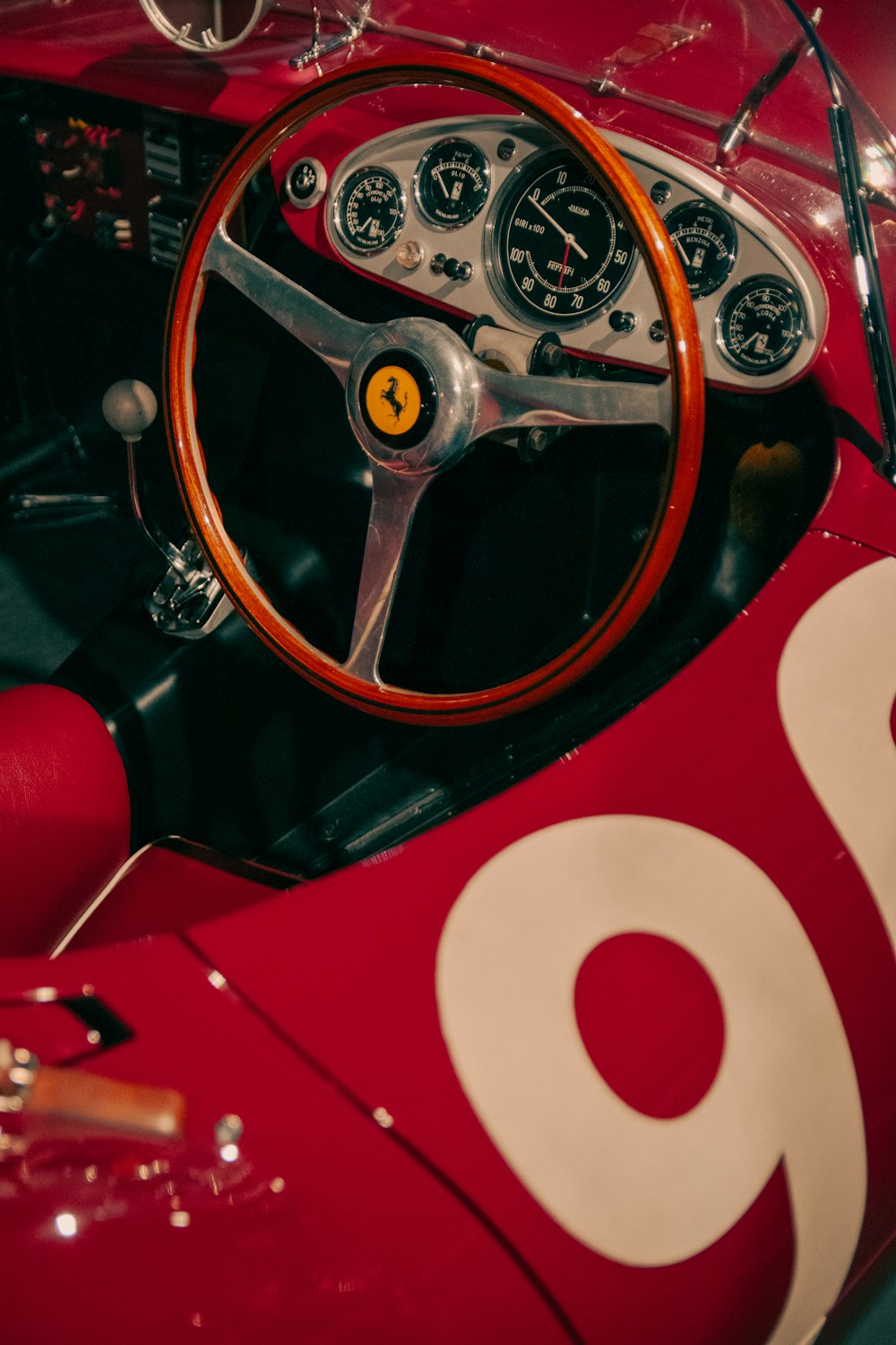 the steering wheel and dashboard of an old race car