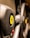 The image focuses on the steering wheel of a luxury sports car, featuring a prominent yellow emblem with a black prancing horse. The leather texture and sleek design elements suggest high-quality craftsmanship.