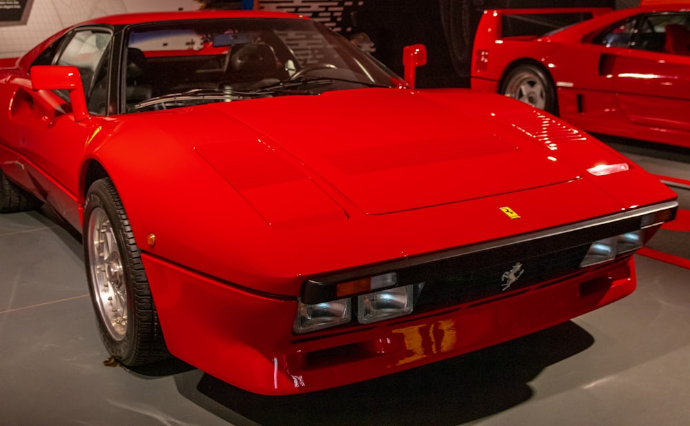 a red sports car parked in a garage