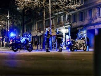 a group of motorcycles parked on the side of a road