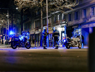 a group of motorcycles parked on the side of a road