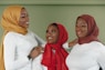 a group of women standing next to each other