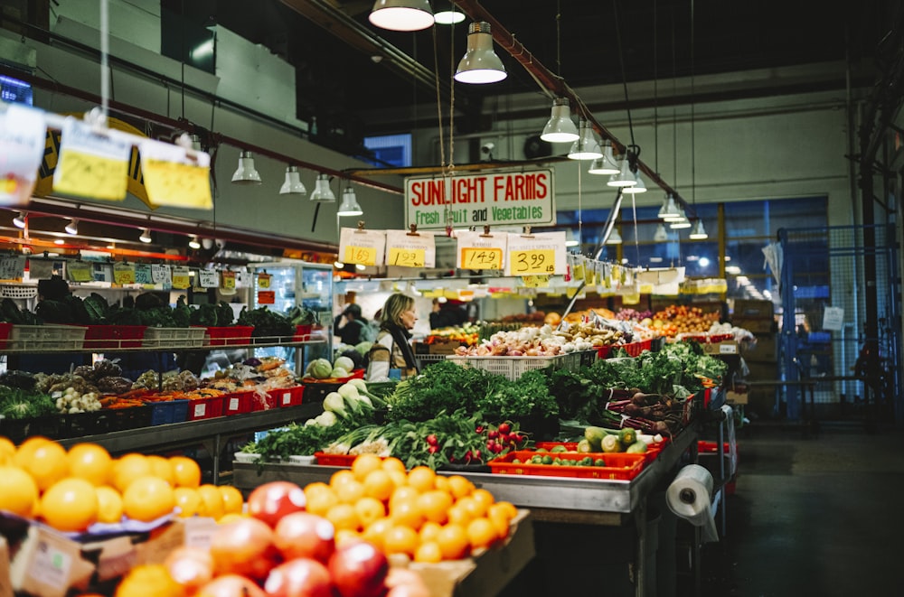 a market filled with lots of fresh fruits and vegetables