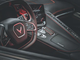 A stylish steering wheel wrapped in premium leather inside a modern car