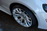 A close-up of a shiny alloy wheel on a car.
