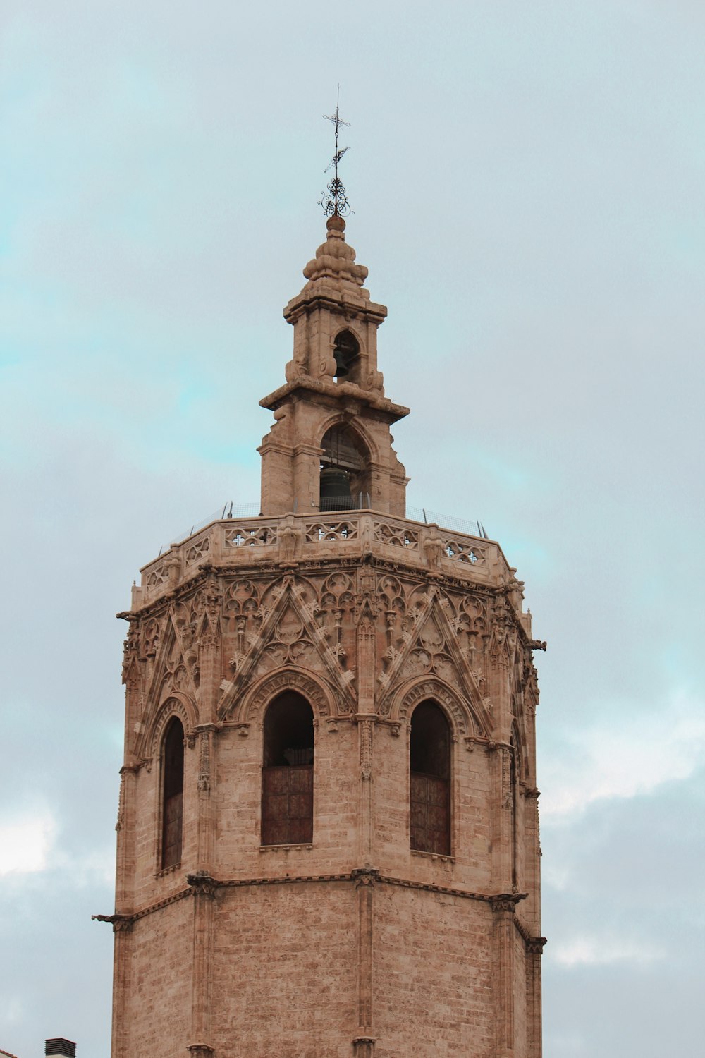 a tall tower with a clock on the top of it