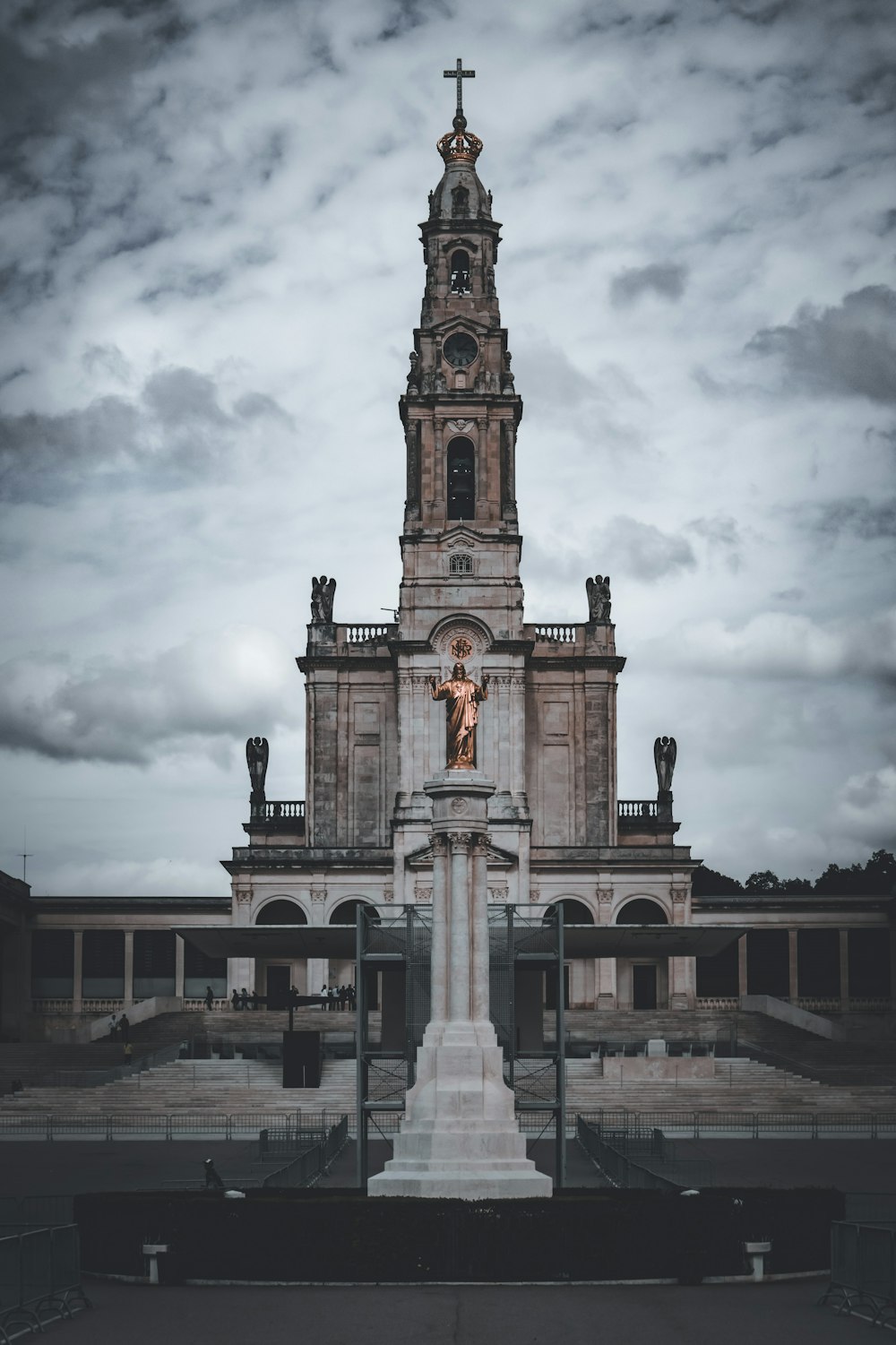 a very tall building with a cross on top of it