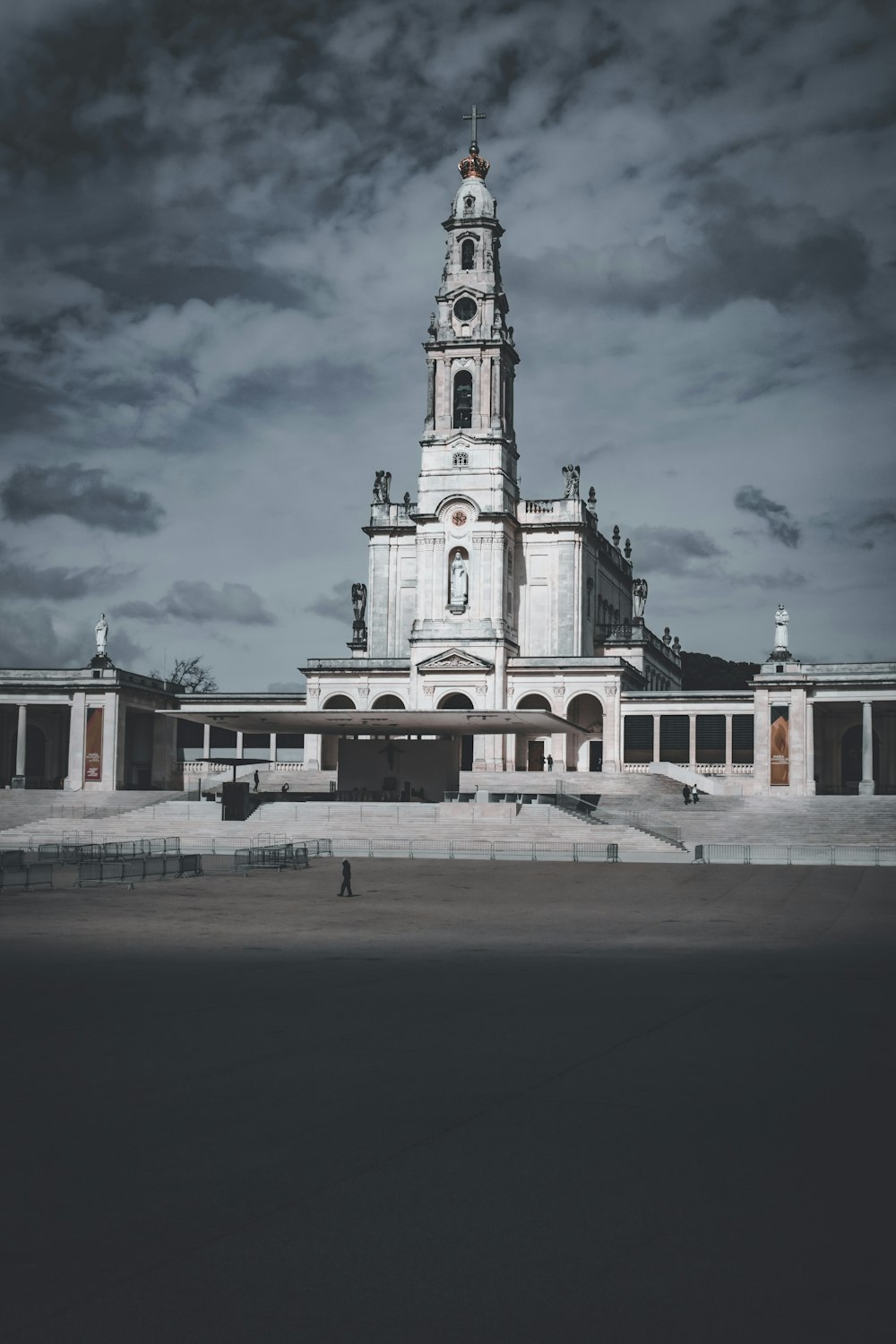 a large white building with a clock tower