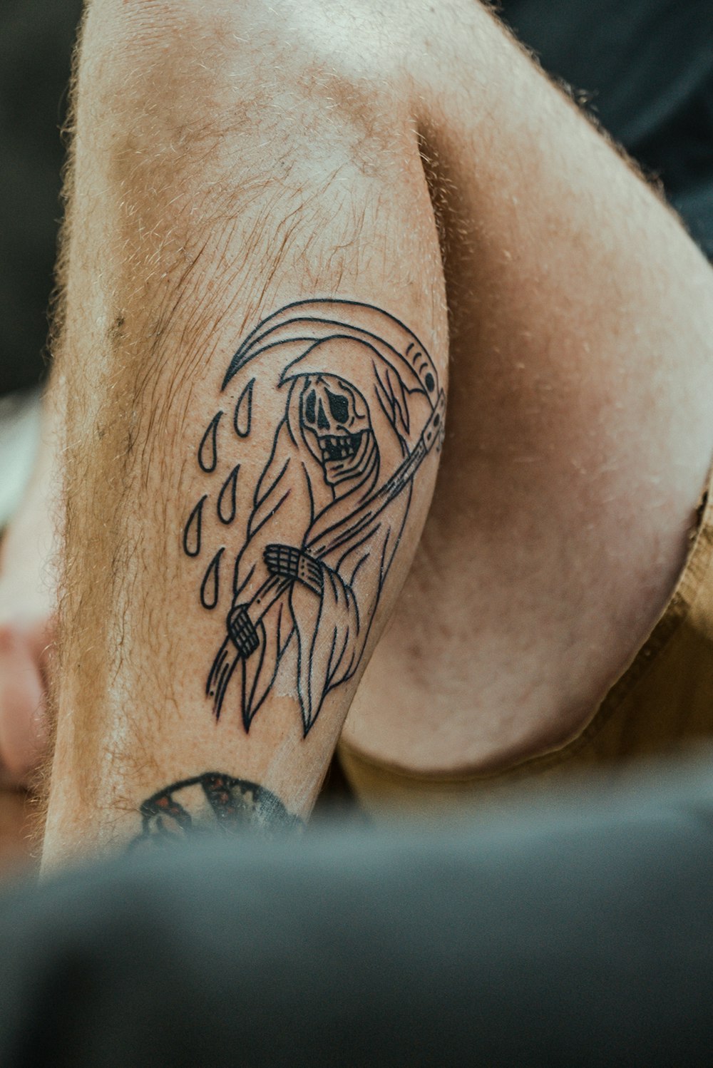 a man with a tattoo on his leg