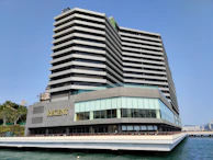 Exterior view of Regatta Hub showcasing its sleek architecture against a clear blue sky.