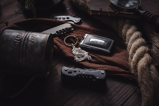 Various personalized mugs and keychains arranged on a wooden table.