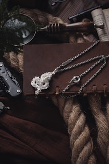 a knife, chain, and other items on a table
