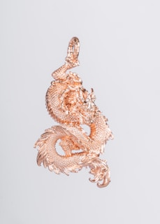 A beautifully crafted dragon pendant symbolizing strength and protection.