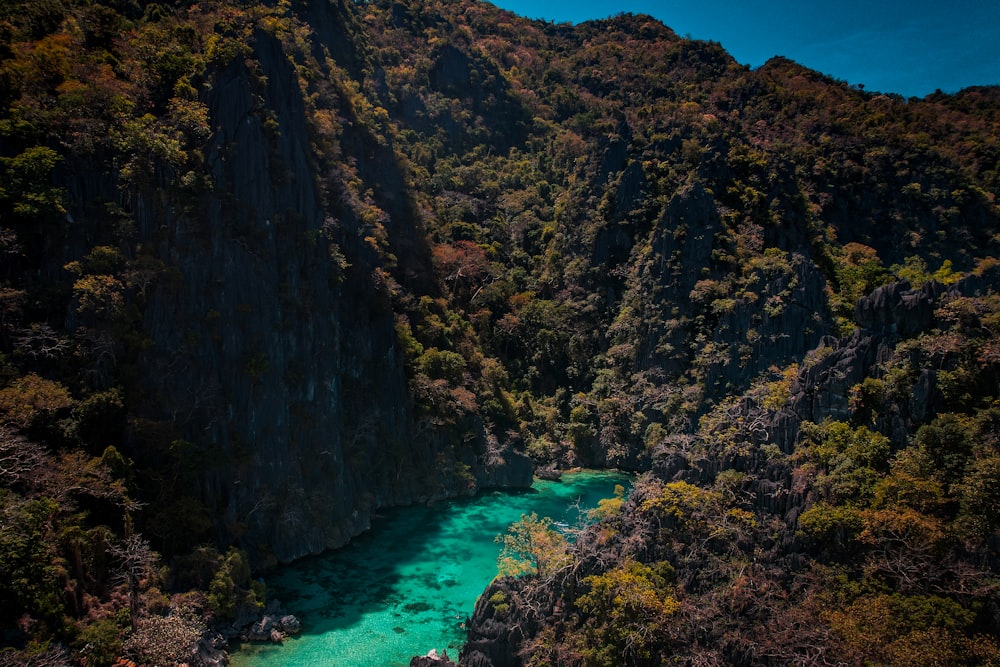 an aerial view of a river surrounded by mountains