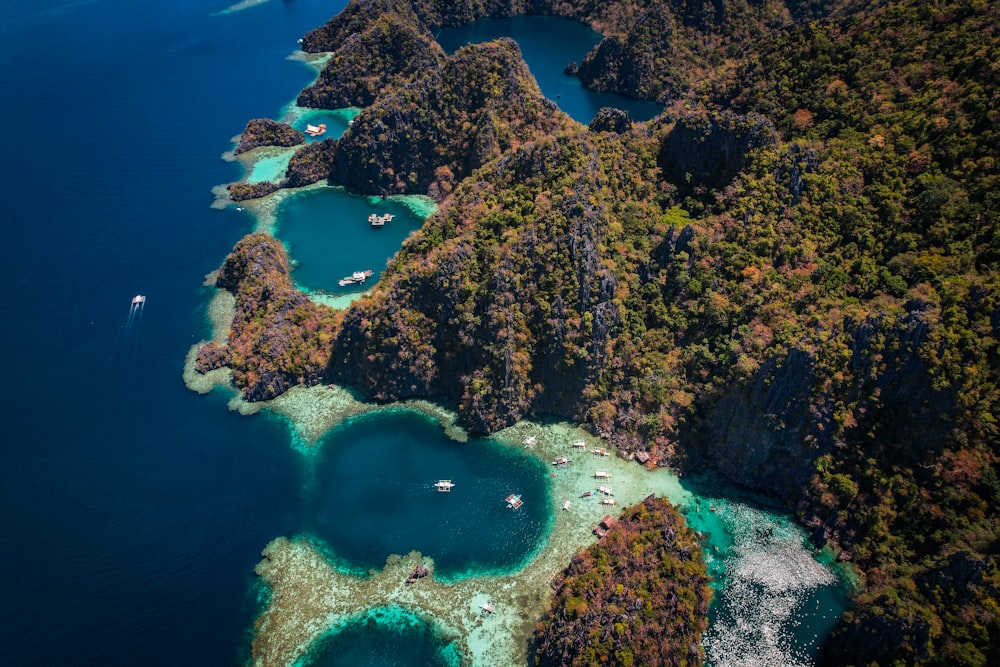 an aerial view of a tropical island with a lagoon