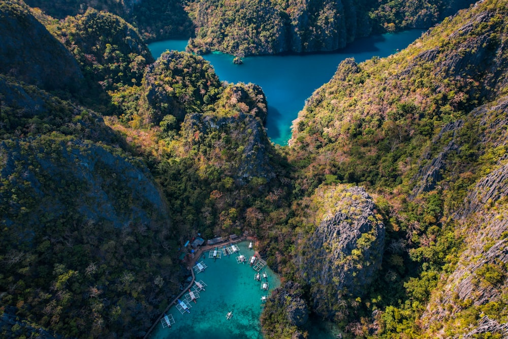 an aerial view of a lake surrounded by mountains