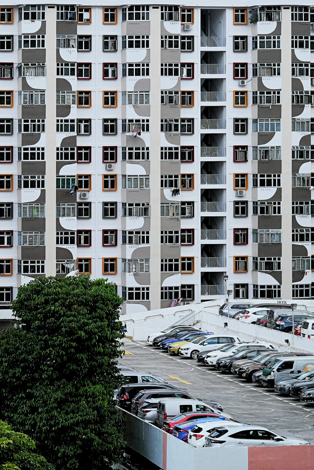 a parking lot in front of a tall building