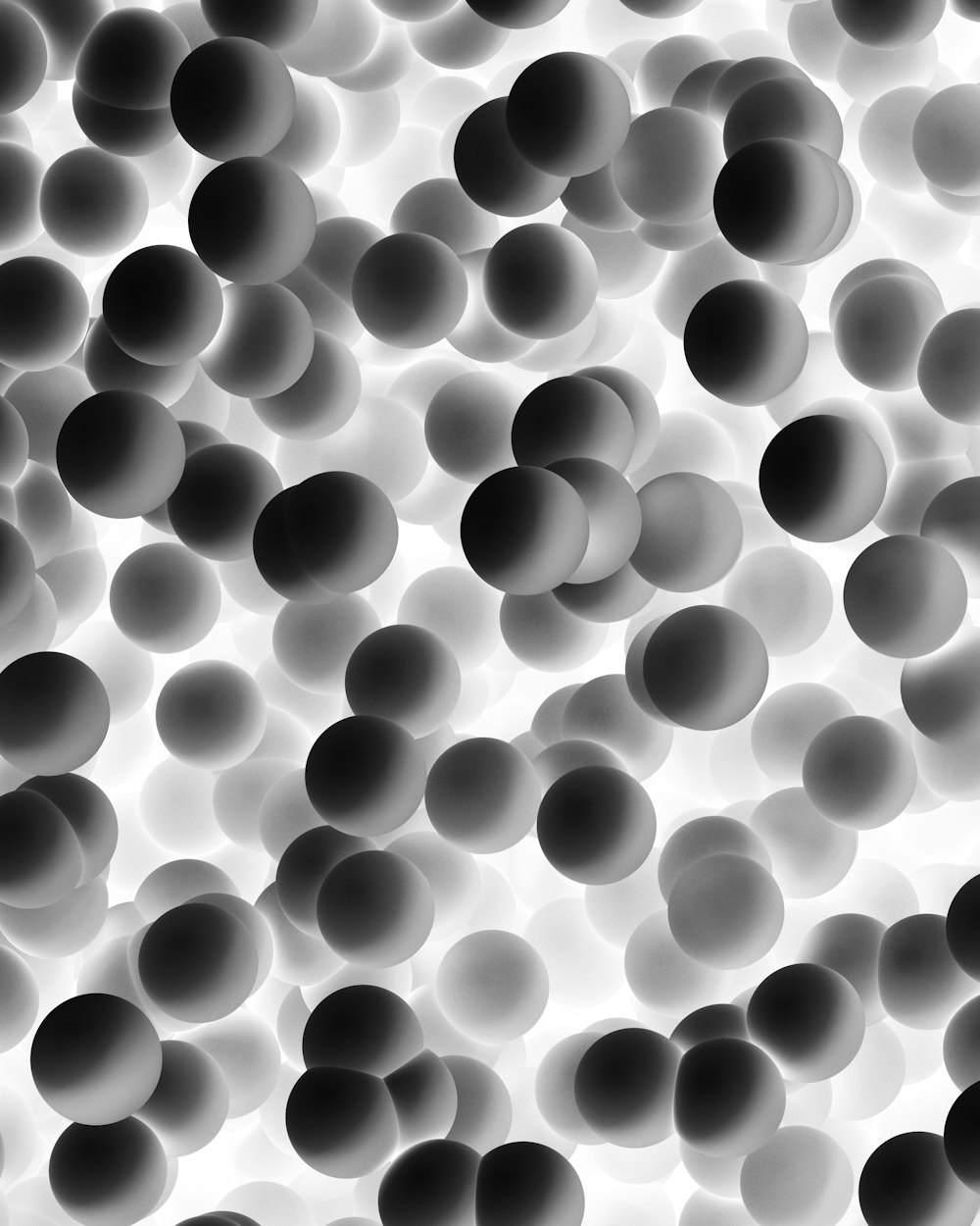 a black and white photo of a bunch of balls