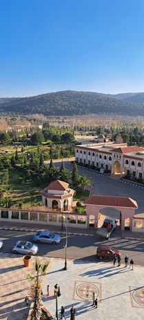 A panoramic view of the Alhambra palace in Granada, Spain, under a clear blue sky.