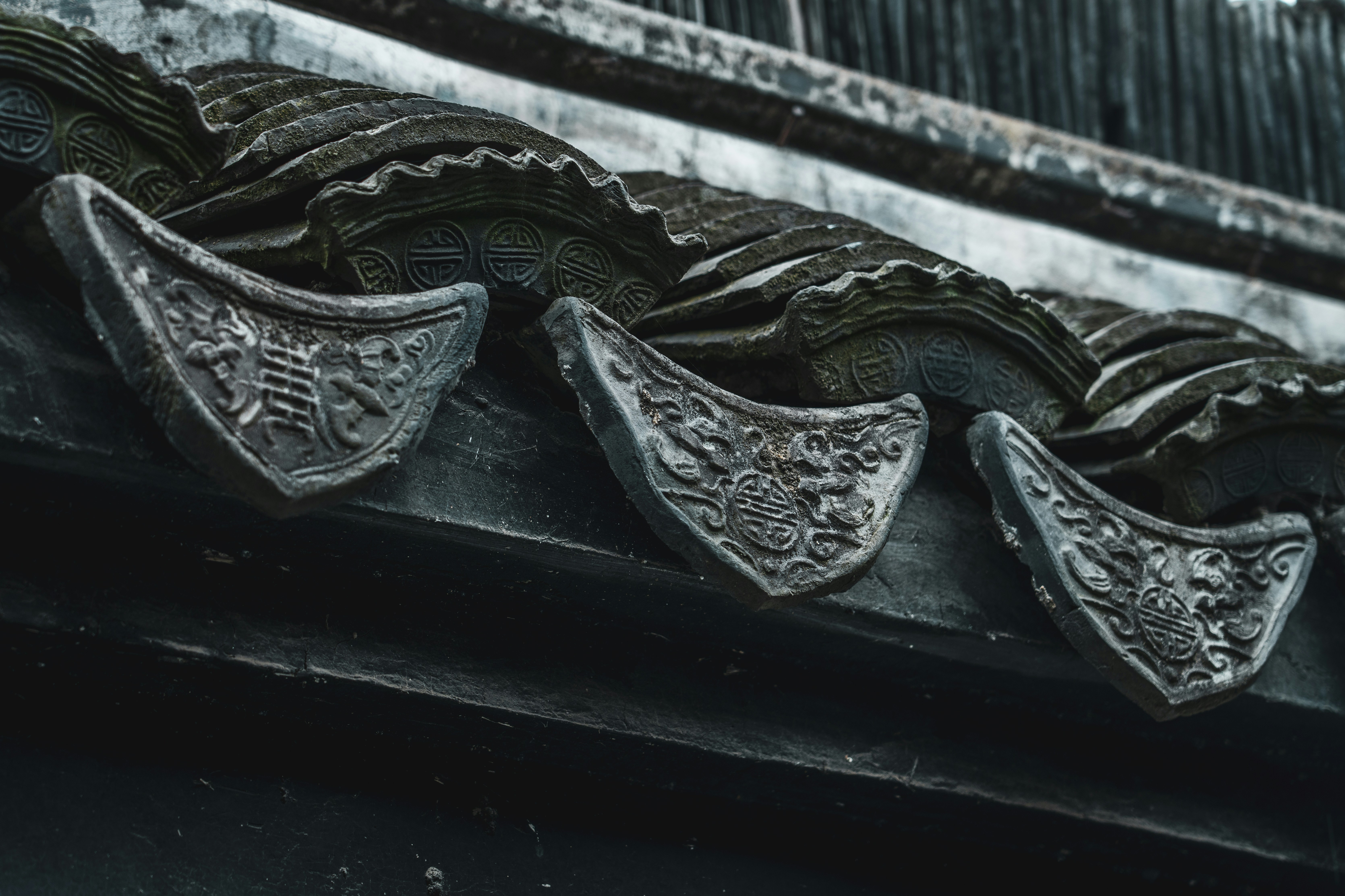 a close up of a metal roof with ornate designs