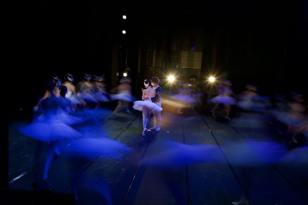 a group of people dancing on a stage