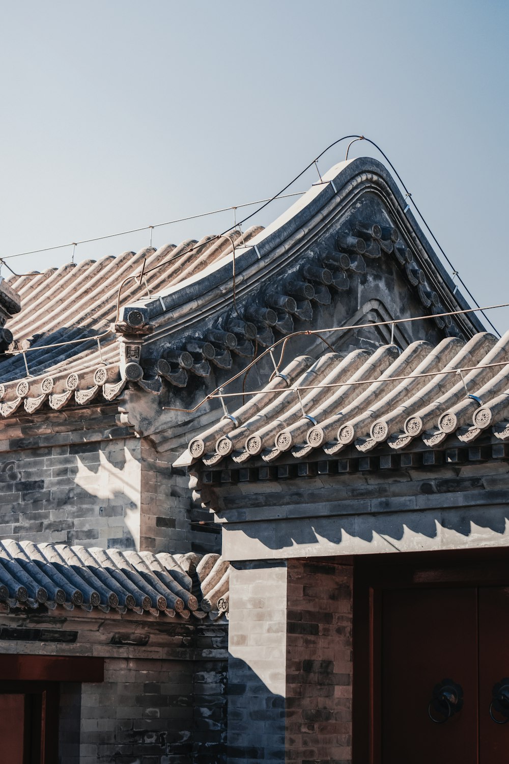 the roof of a building with a sky background