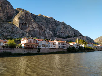 a row of houses next to a river