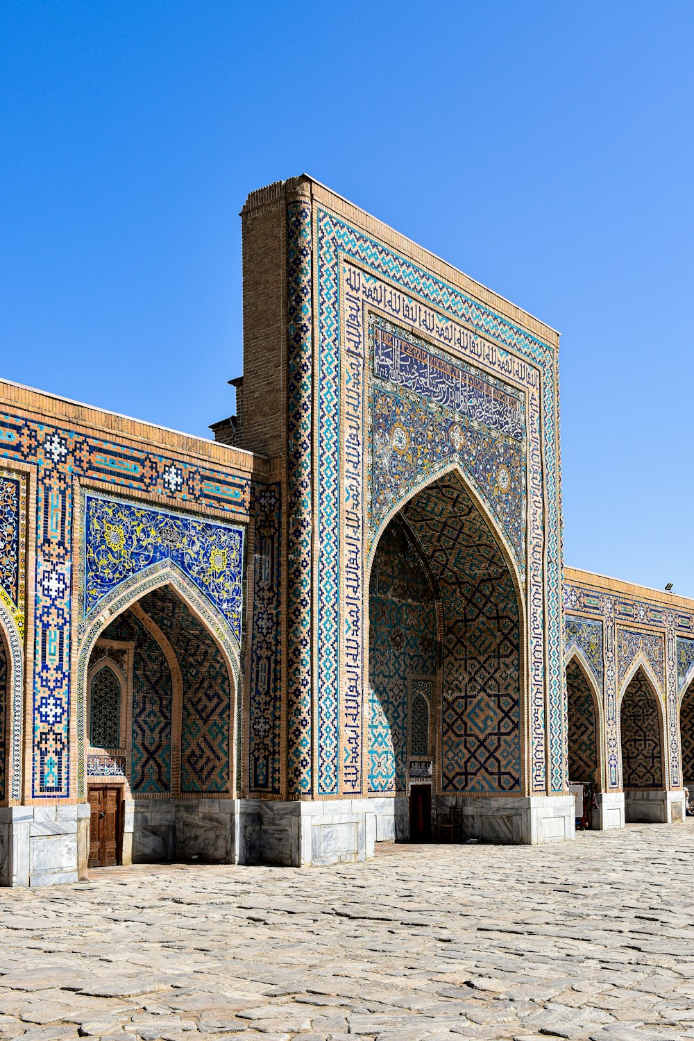 a large building with a lot of blue tiles on it