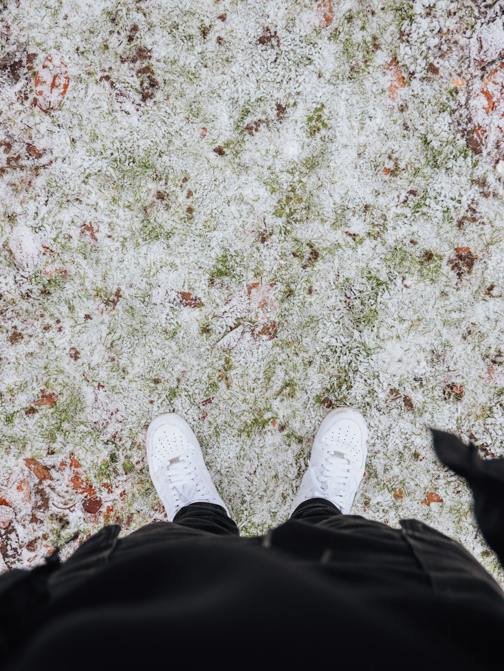 a person standing in front of a snow covered ground