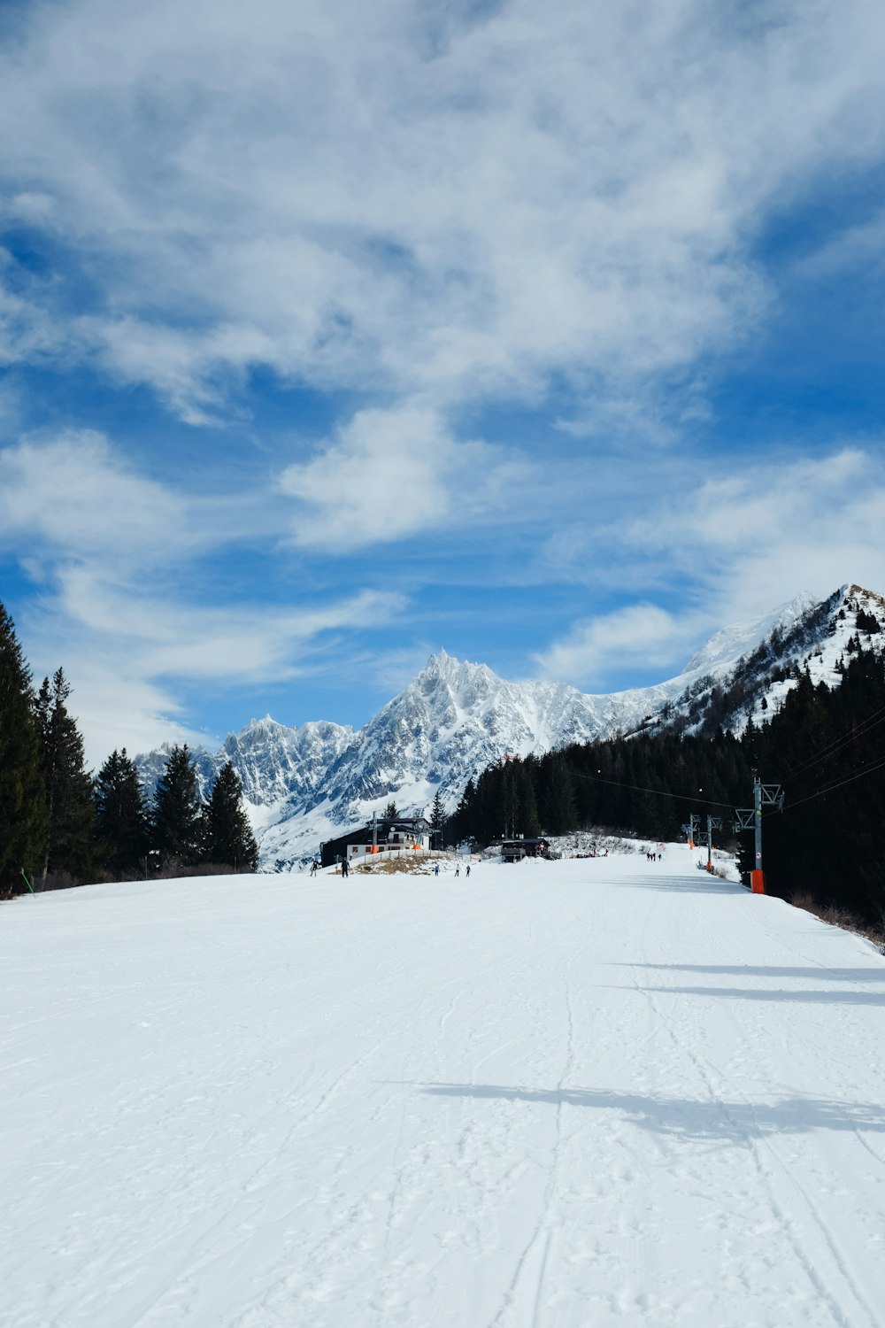 a person riding skis on a snowy surface