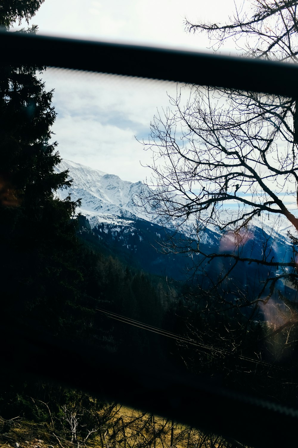 a view of a mountain through a window