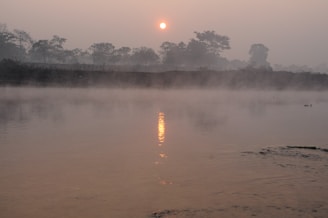 A tranquil river scene in Varanasi at sunrise.