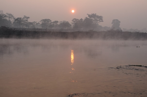 A tranquil river scene in Varanasi at sunrise.