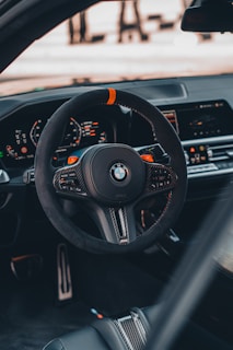 Close-up of the Aion electric car's futuristic dashboard and steering wheel