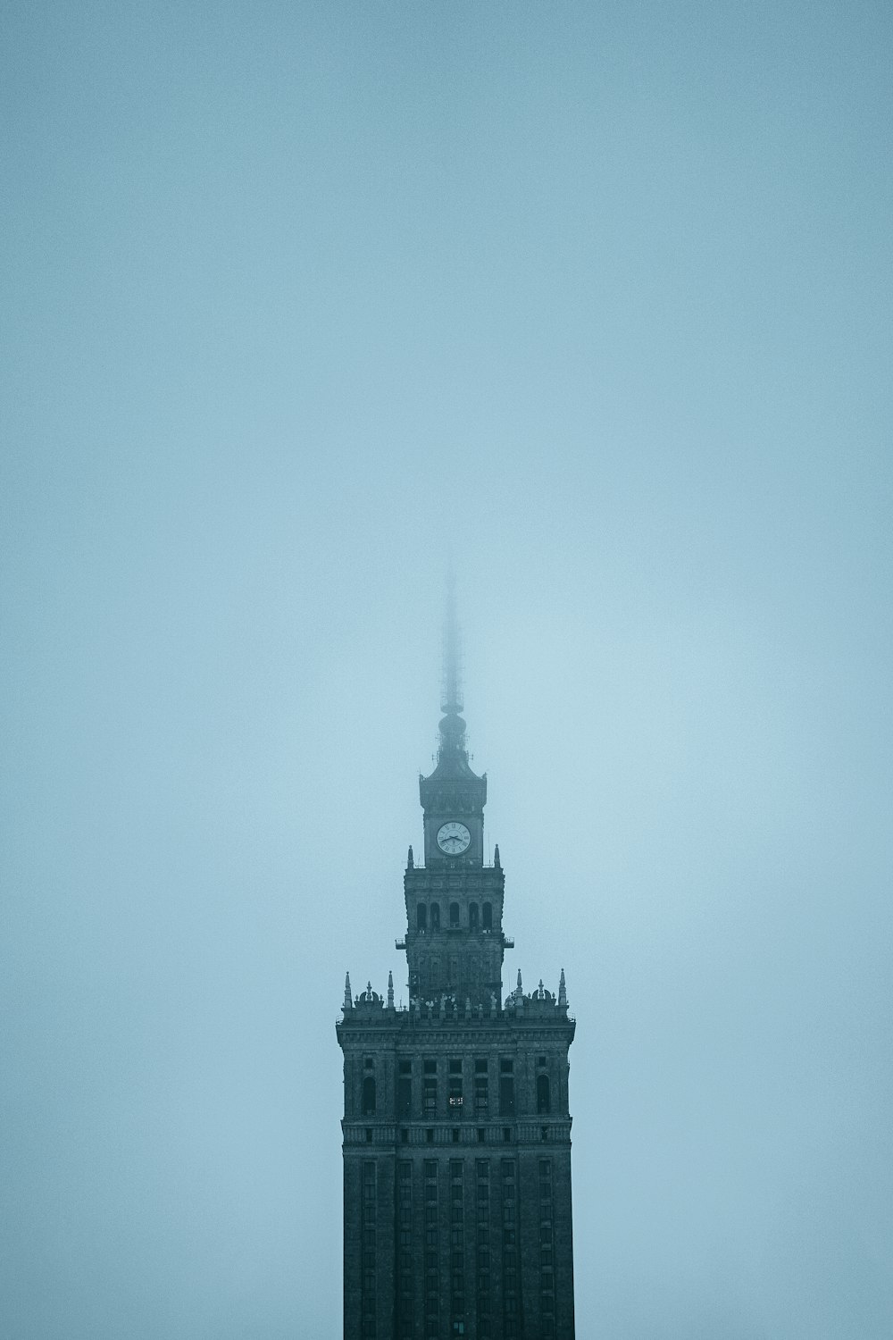 a tall building with a clock on the top of it