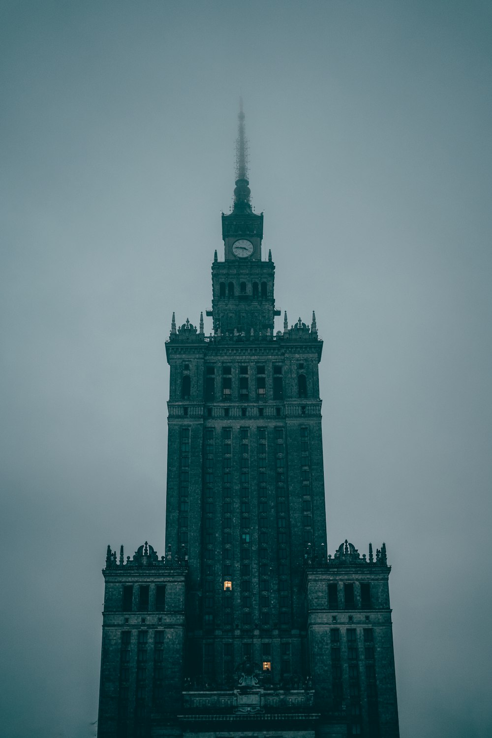 a tall building with a clock on the top of it