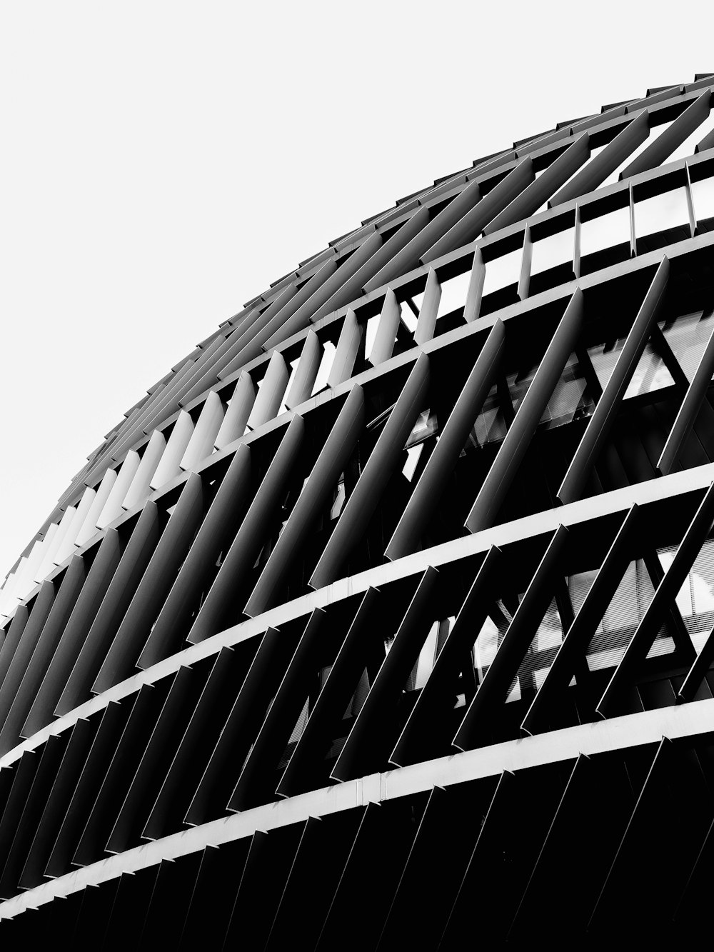 a black and white photo of a circular building