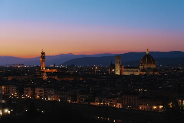 Elegant cityscape of Graz at dusk with soft lighting reflecting a sophisticated atmosphere.