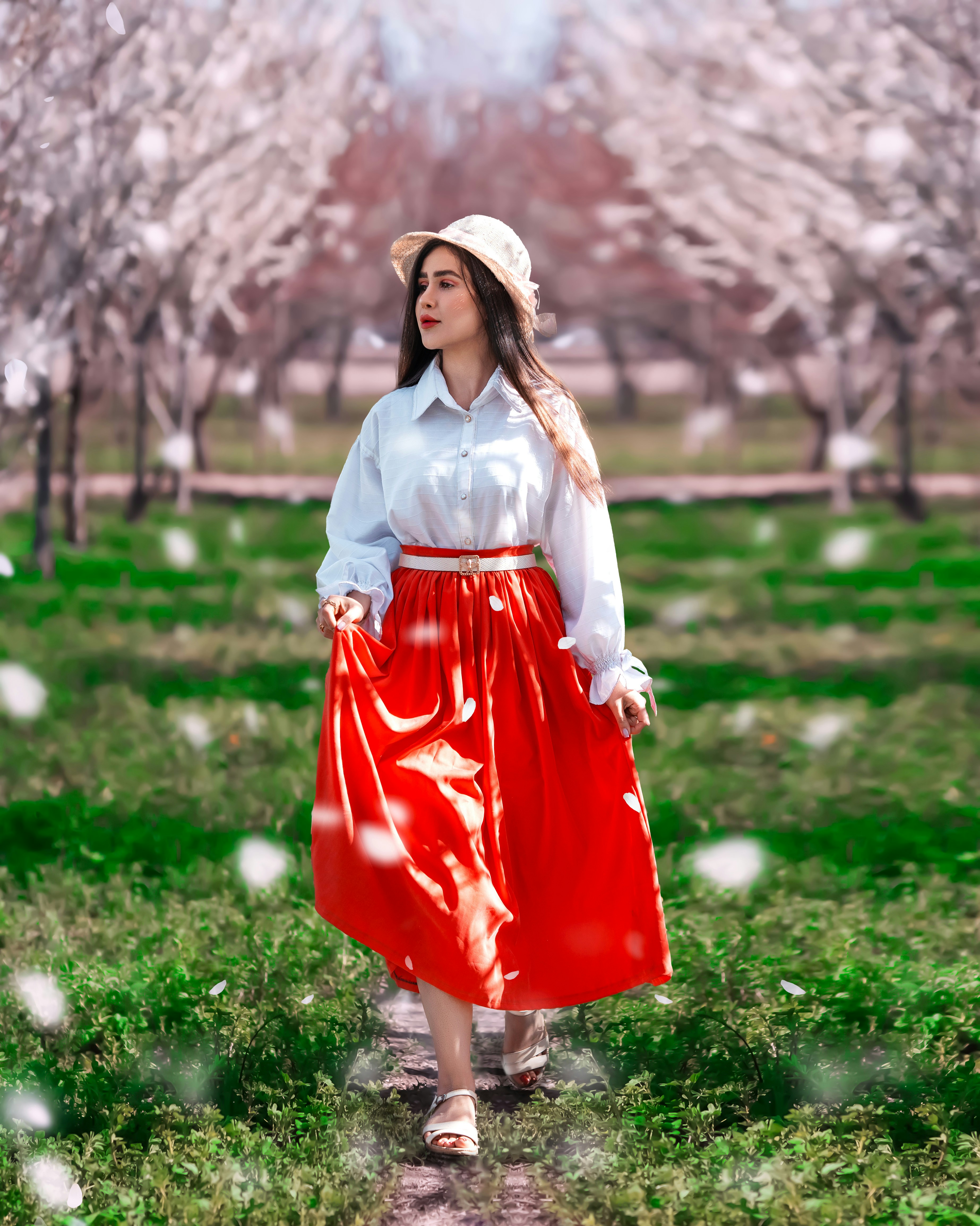 A woman wearing a red skirt and a white shirt photo – Free Model Image ...