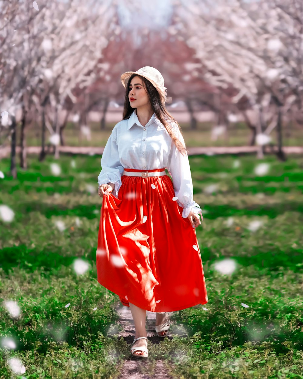 a woman wearing a red skirt and a white shirt
