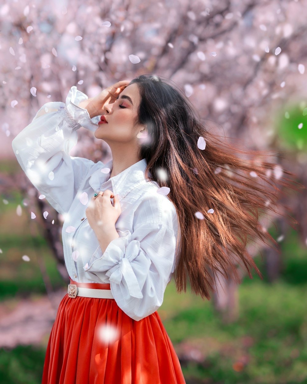 a woman in a red skirt and white shirt