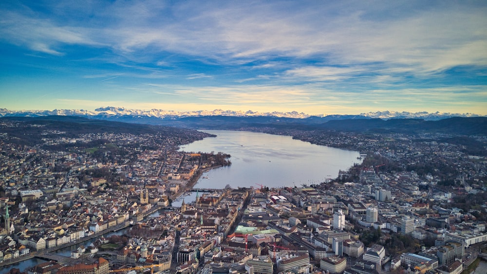 an aerial view of a city and a body of water