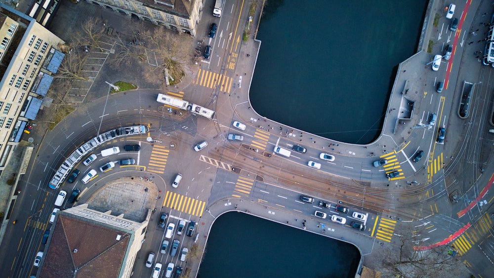 an aerial view of a street intersection with cars