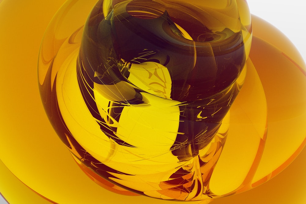 a glass vase sitting on top of a yellow plate