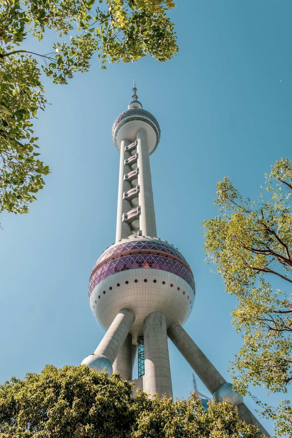 a very tall tower with a clock on it's side