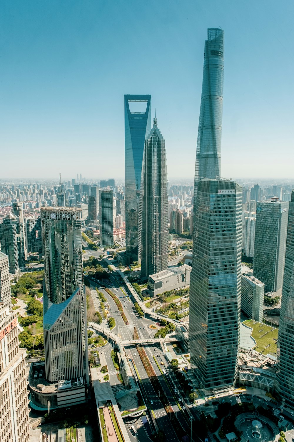 an aerial view of a city with tall buildings