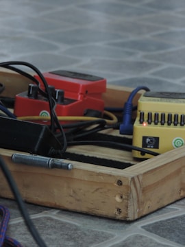 A lineup of Plague Audio pedals on a wooden table, showing variety.