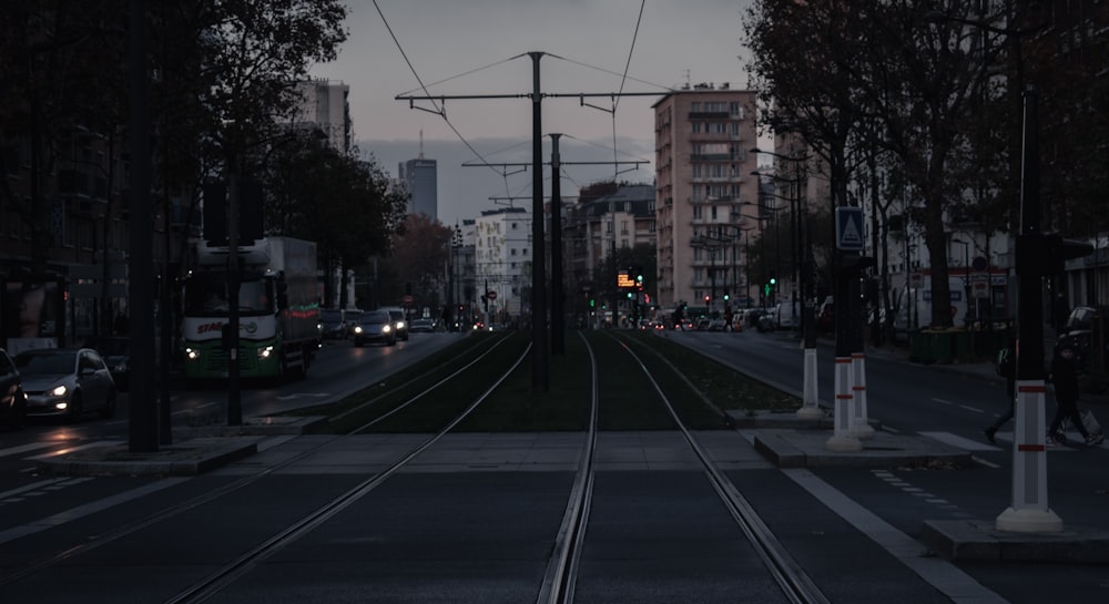 a city street with a train track running through it