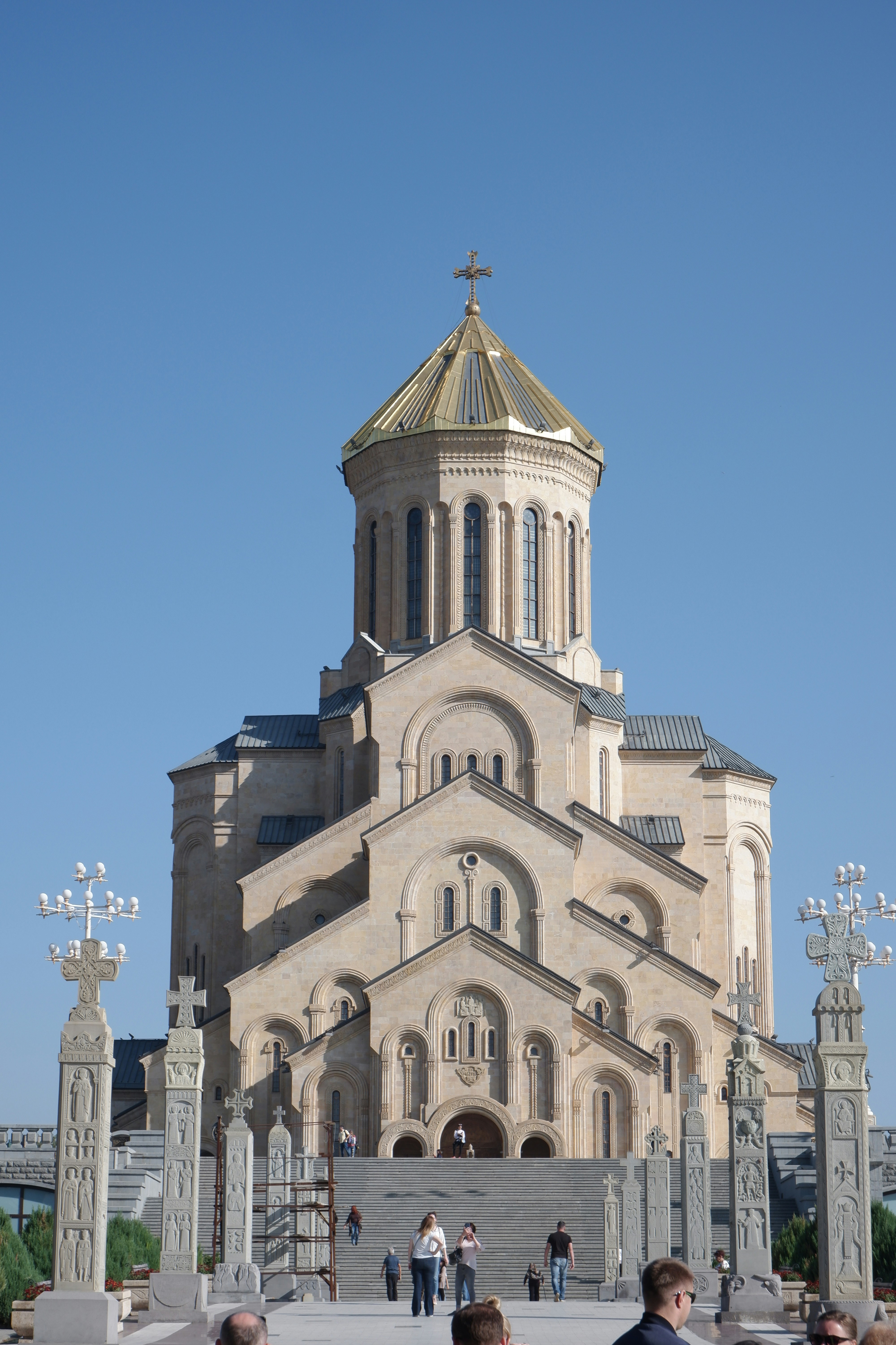 a group of people standing in front of a church