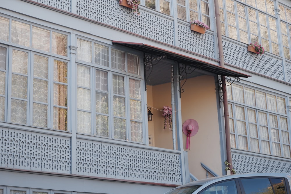 a car is parked in front of a building